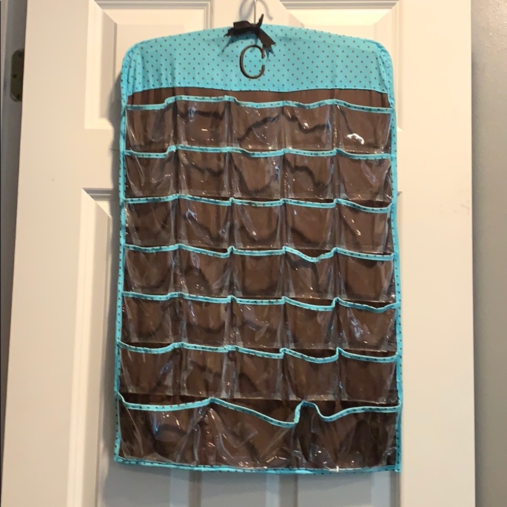 Hanging make up/jewelry holder